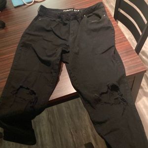 Black skinny jeans with ripped knees